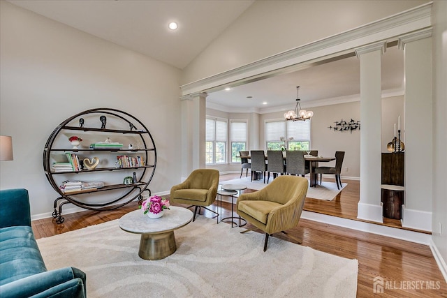 37 Equestrian Way, Monroe, NJ 08831 - sitting room with ornate columns, a chandelier, baseboards, wood finished floors, and ornamental molding