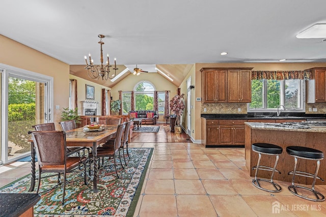 9 Narrow Brook Ct, Plainsboro, NJ 08536 - dining space featuring vaulted ceiling, light tile patterned floors, a chandelier, recessed lighting, and ceiling fan