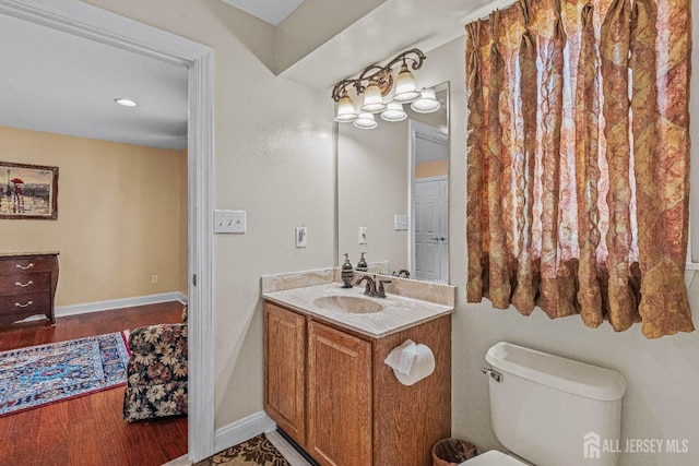 9 Narrow Brook Ct, Plainsboro, NJ 08536 - half bathroom with vanity, toilet, wood finished floors, and baseboards