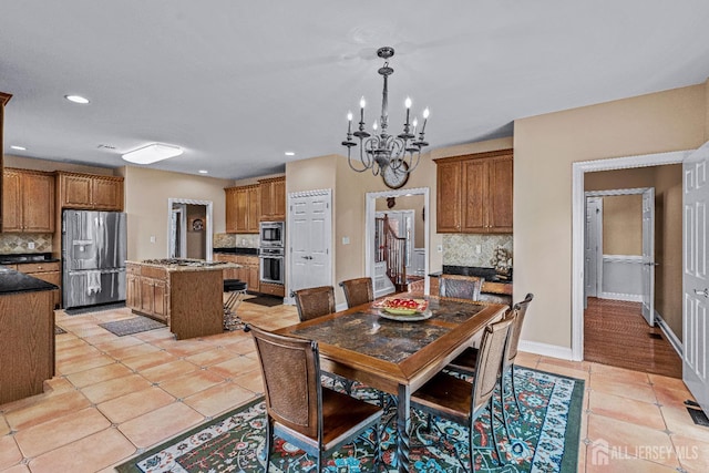 9 Narrow Brook Ct, Plainsboro, NJ 08536 - dining room featuring light tile patterned flooring, a chandelier, recessed lighting, and baseboards