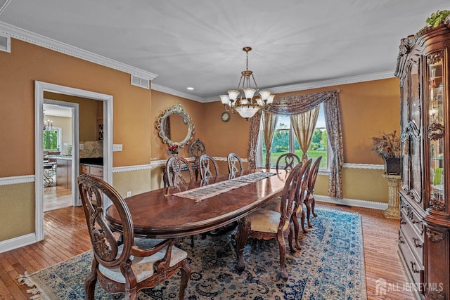 9 Narrow Brook Ct, Plainsboro, NJ 08536 - dining area featuring a chandelier, baseboards, light wood finished floors, and crown molding