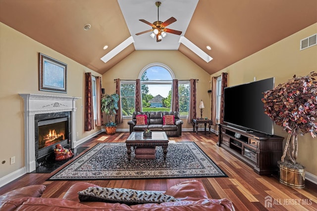 9 Narrow Brook Ct, Plainsboro, NJ 08536 - living room with a skylight, ceiling fan, vaulted ceiling, a premium fireplace, and wood finished floors