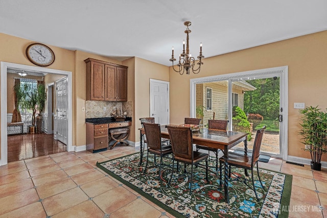 9 Narrow Brook Ct, Plainsboro, NJ 08536 - dining space with a chandelier, healthy amount of natural light, baseboards, and light tile patterned floors