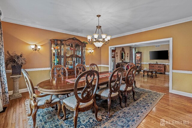 9 Narrow Brook Ct, Plainsboro, NJ 08536 - dining area featuring a chandelier, wood finished floors, ornamental molding, and baseboards