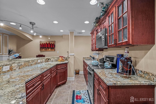 9 Narrow Brook Ct, Plainsboro, NJ 08536 - kitchen with stainless steel electric range, dark brown cabinets, recessed lighting, light stone countertops, and glass insert cabinets