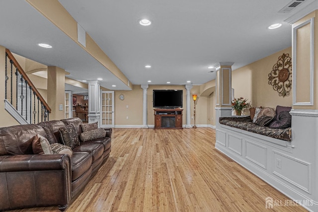 9 Narrow Brook Ct, Plainsboro, NJ 08536 - living room featuring decorative columns, light wood-type flooring, recessed lighting, baseboards, and stairs
