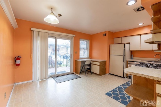 182 Evergreen Rd Unit 9A, Edison, NJ 08837 - kitchen featuring freestanding refrigerator, a sink, light countertops, light flooring, and white cabinets