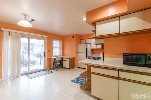 182 Evergreen Rd Unit 9A, Edison, NJ 08837 - kitchen featuring black microwave, freestanding refrigerator, light floors, light countertops, and recessed lighting
