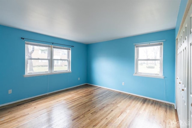 182 Evergreen Rd Unit 9A, Edison, NJ 08837 - spare room featuring plenty of natural light, wood finished floors, and baseboards