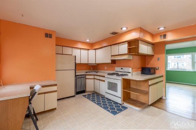 182 Evergreen Rd Unit 9A, Edison, NJ 08837 - kitchen with white appliances, open shelves, ventilation hood, a sink, and light countertops