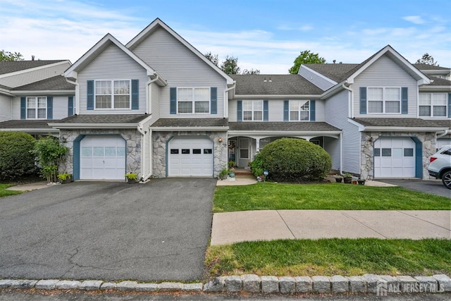 82 Heather Ct, South Brunswick, NJ 08852 - view of property with stone siding, driveway, a garage, and a front yard