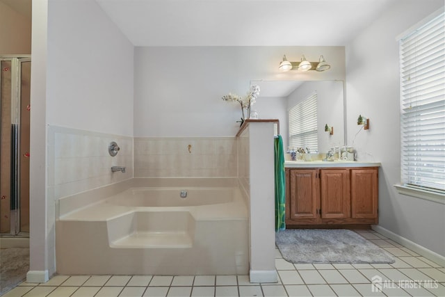 82 Heather Ct, South Brunswick, NJ 08852 - full bath featuring healthy amount of natural light, a bath, vanity, and tile patterned flooring