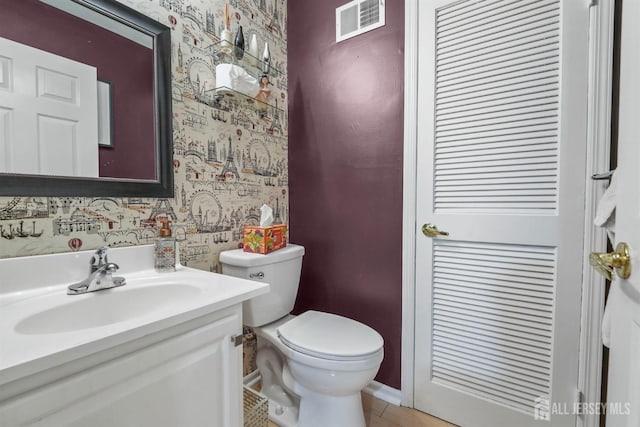 82 Heather Ct, South Brunswick, NJ 08852 - bathroom with wallpapered walls, toilet, vanity, tile patterned flooring, and baseboards