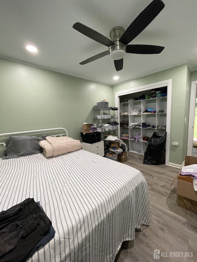 23 Hanover Sq Unit 23D, Middlesex, NJ 08846 - bedroom featuring wood finished floors, ceiling fan, a closet, and recessed lighting