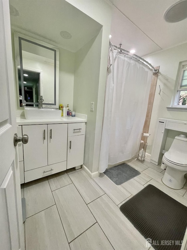 23 Hanover Sq Unit 23D, Middlesex, NJ 08846 - bathroom with vanity, a shower with curtain, and wood finish floors