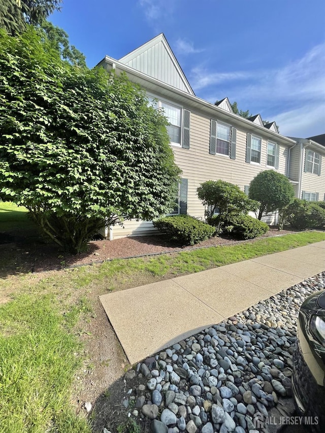 23 Hanover Sq Unit 23D, Middlesex, NJ 08846 - view of property exterior with board and batten siding