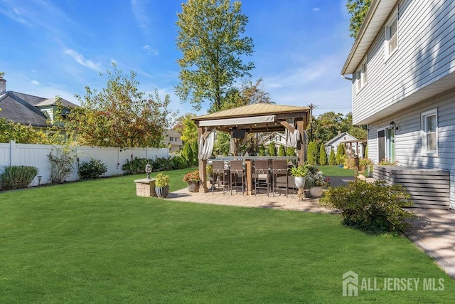 view of yard with a gazebo, fence private yard, and a patio