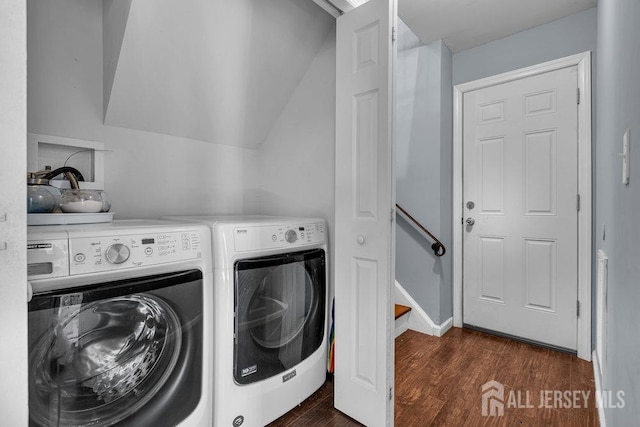 washroom featuring laundry area, independent washer and dryer, and dark wood-style flooring