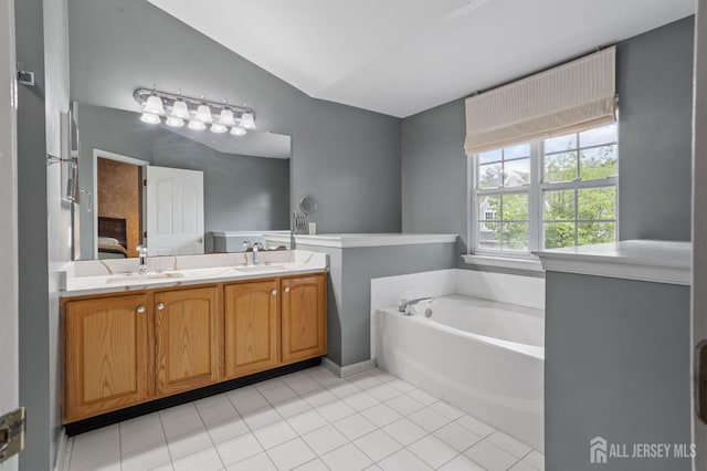 1905 Dahlia Cir S, Brunswick, NJ 08810 - ensuite bathroom with lofted ceiling, a bath, double vanity, and tile patterned floors