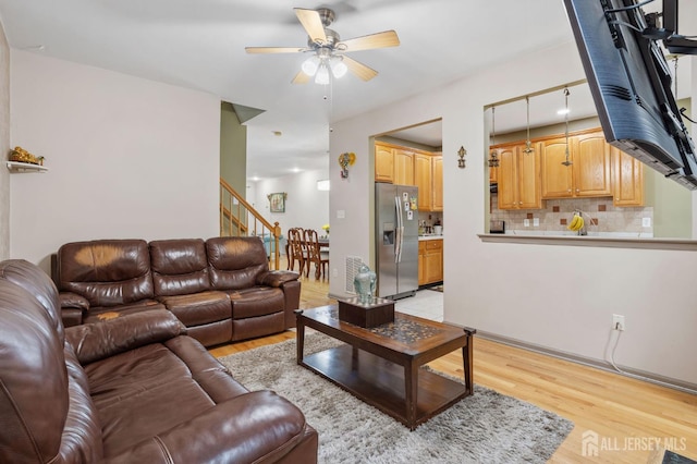 1905 Dahlia Cir S, Brunswick, NJ 08810 - living room with light wood-type flooring, ceiling fan, and stairs