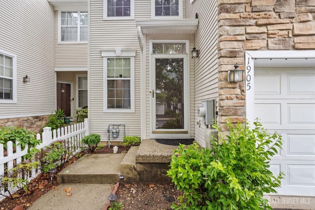 1905 Dahlia Cir S, Brunswick, NJ 08810 - property entrance featuring stone siding and a garage
