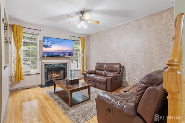 1905 Dahlia Cir S, Brunswick, NJ 08810 - living area with wood-type flooring, ceiling fan, and a high end fireplace