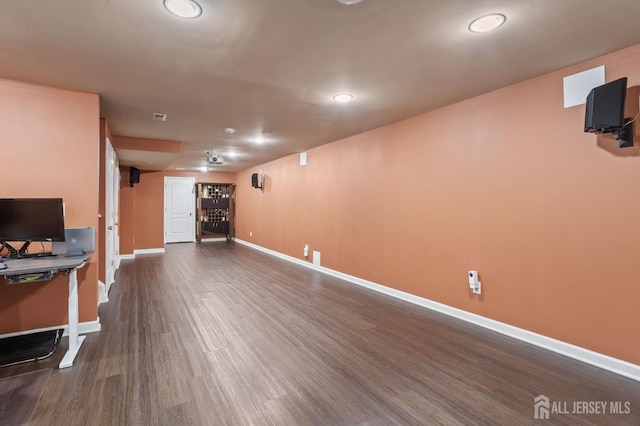 1905 Dahlia Cir S, Brunswick, NJ 08810 - unfurnished living room featuring dark wood-type flooring and recessed lighting