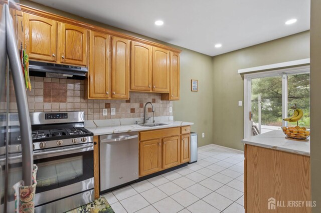 1905 Dahlia Cir S, Brunswick, NJ 08810 - kitchen with stainless steel appliances, extractor fan, tasteful backsplash, light tile patterned flooring, and light stone counters