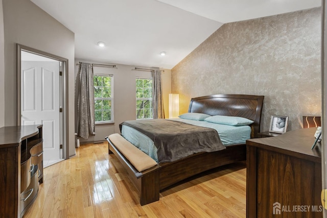 1905 Dahlia Cir S, Brunswick, NJ 08810 - bedroom featuring lofted ceiling, light wood-style floors, and an accent wall