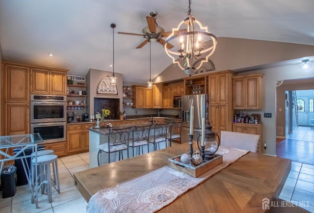 20 N Shore Blvd Unit B, Helmetta, NJ 08828 - dining room featuring vaulted ceiling, light tile patterned floors, ceiling fan, and a chandelier