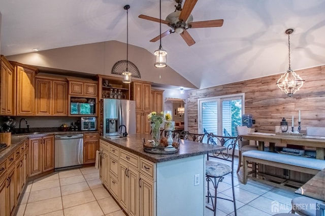 20 N Shore Blvd Unit B, Helmetta, NJ 08828 - kitchen featuring appliances with stainless steel finishes, light tile patterned floors, ceiling fan, high vaulted ceiling, and a breakfast bar