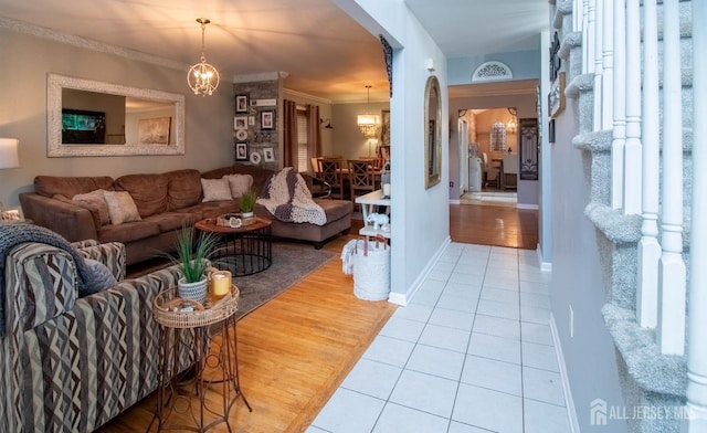 20 N Shore Blvd Unit B, Helmetta, NJ 08828 - tiled living area featuring a chandelier, arched walkways, and crown molding
