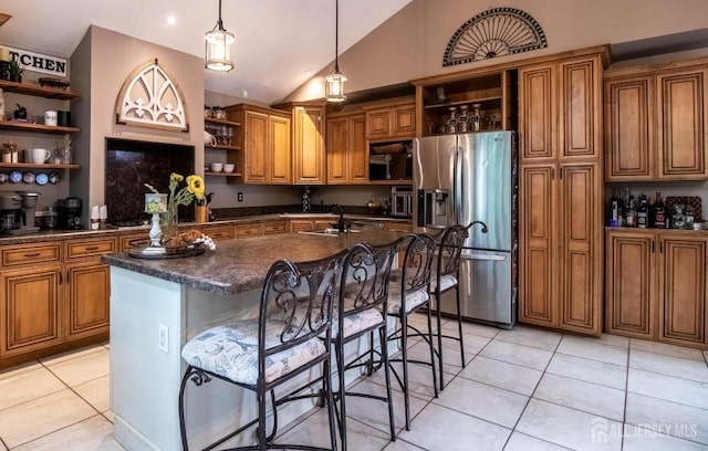 20 N Shore Blvd Unit B, Helmetta, NJ 08828 - kitchen with open shelves, stainless steel appliances, brown cabinetry, vaulted ceiling, and dark countertops