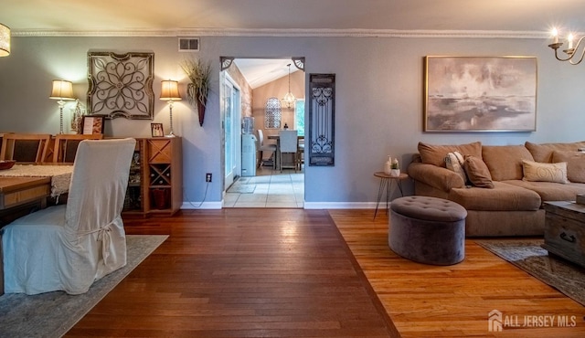 20 N Shore Blvd Unit B, Helmetta, NJ 08828 - living room with a chandelier, hardwood / wood-style flooring, and crown molding
