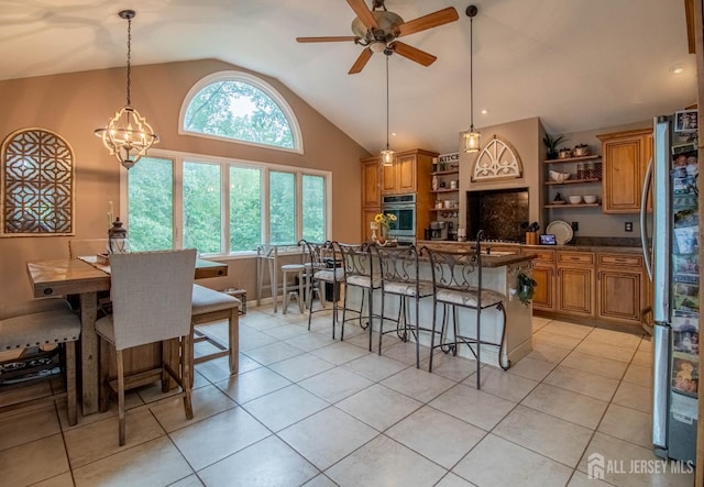 20 N Shore Blvd Unit B, Helmetta, NJ 08828 - kitchen featuring open shelves, appliances with stainless steel finishes, vaulted ceiling, and brown cabinetry