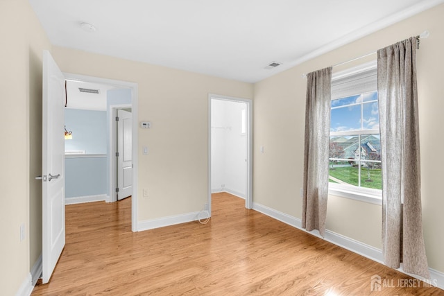 10 E Black Heath Ct, Howell, NJ 07727 - unfurnished bedroom featuring light wood-style floors, a spacious closet, and a closet