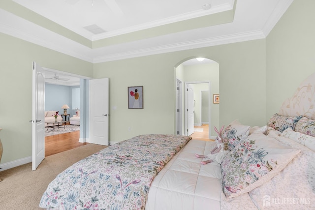 10 E Black Heath Ct, Howell, NJ 07727 - bedroom with arched walkways, a raised ceiling, ornamental molding, light carpet, and ceiling fan