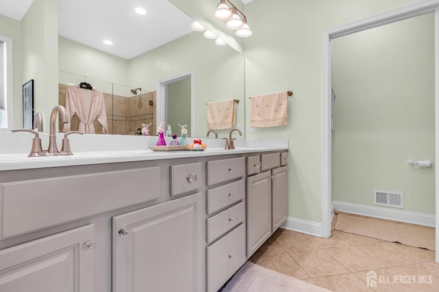 10 E Black Heath Ct, Howell, NJ 07727 - bathroom with double vanity, tile patterned flooring, and tiled shower