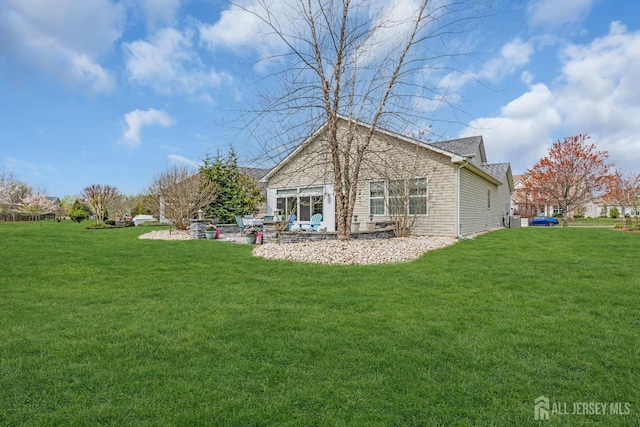 10 E Black Heath Ct, Howell, NJ 07727 - rear view of house with a yard