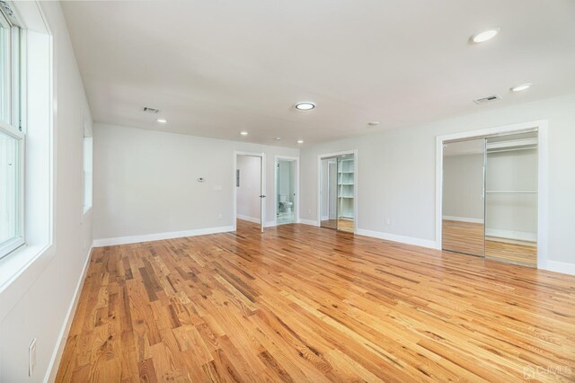 spare room featuring light wood-type flooring