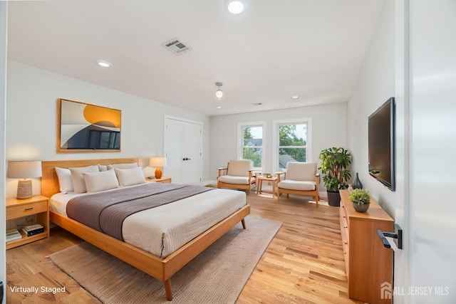 bedroom featuring light wood-type flooring