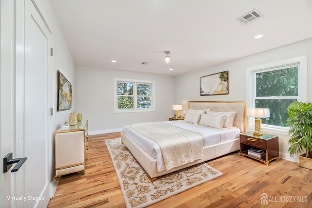 bedroom featuring light hardwood / wood-style floors