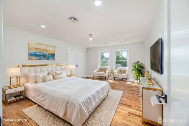 bedroom with light hardwood / wood-style flooring