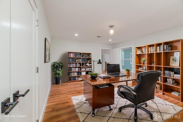 office area with light hardwood / wood-style floors