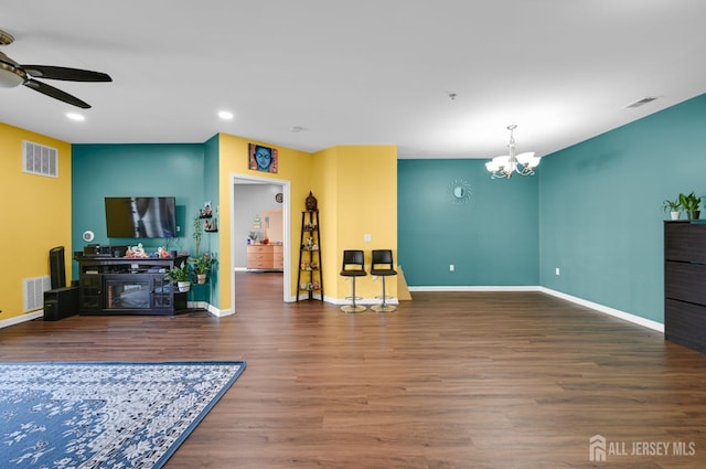 2022 Edward Stec Blvd, Edison, NJ 08837 - living area with a ceiling fan, a chandelier, wood finished floors, a glass covered fireplace, and baseboards