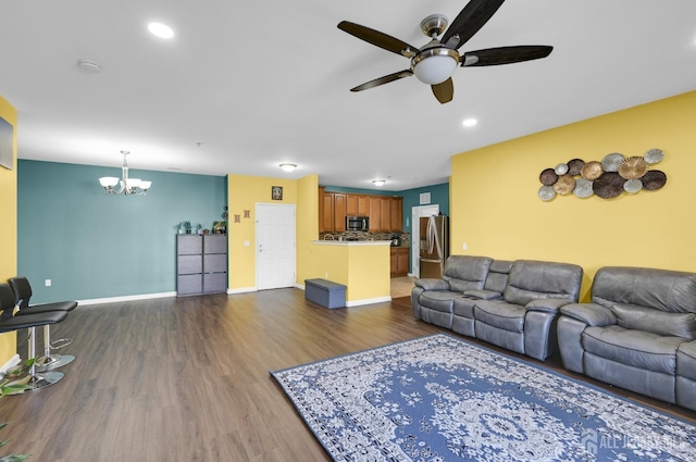 2022 Edward Stec Blvd, Edison, NJ 08837 - living room featuring a ceiling fan, a chandelier, dark wood-type flooring, baseboards, and recessed lighting