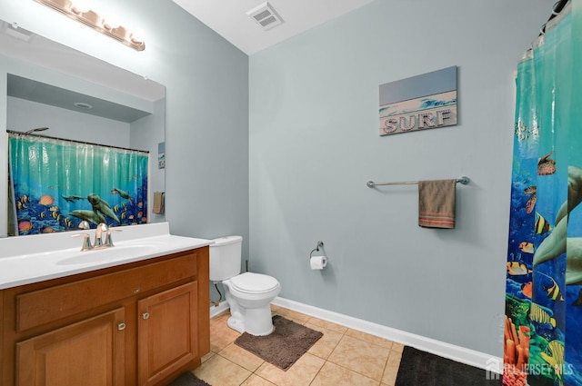 full bathroom with tile patterned flooring, vanity, toilet, and baseboards
