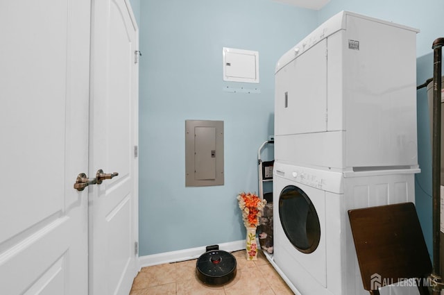 2022 Edward Stec Blvd, Edison, NJ 08837 - laundry room with stacked washer and clothes dryer, electric panel, light tile patterned floors, and baseboards