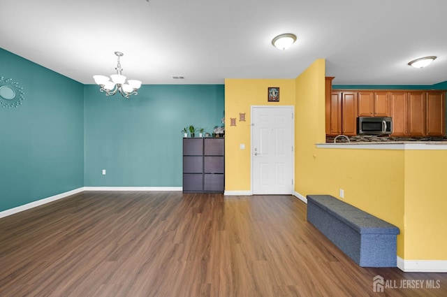 2022 Edward Stec Blvd, Edison, NJ 08837 - kitchen featuring stainless steel microwave, wood finished floors, a chandelier, and baseboards