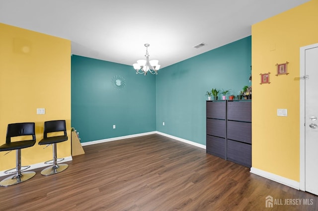 2022 Edward Stec Blvd, Edison, NJ 08837 - unfurnished dining area with wood finished floors, a chandelier, and baseboards